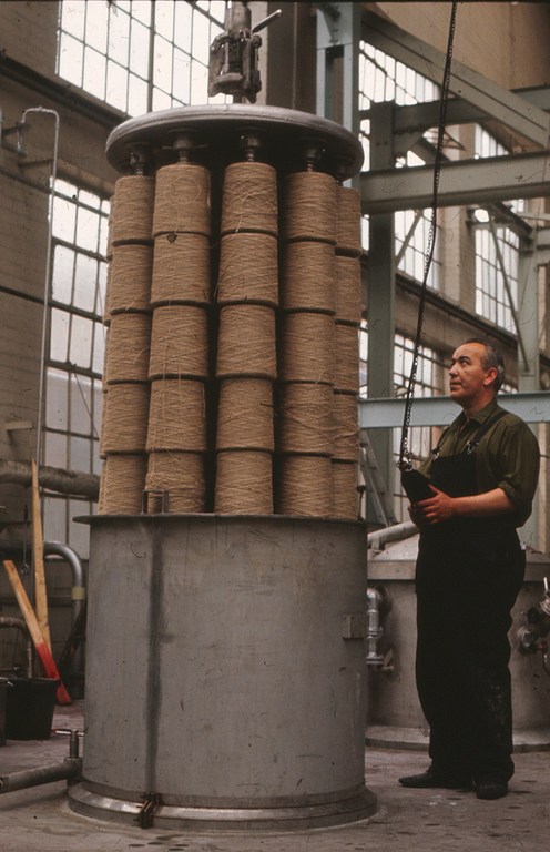 Jute bobbins being lowered into a dyeing vat (pre treatment) DUNIH 2006.1.20.6