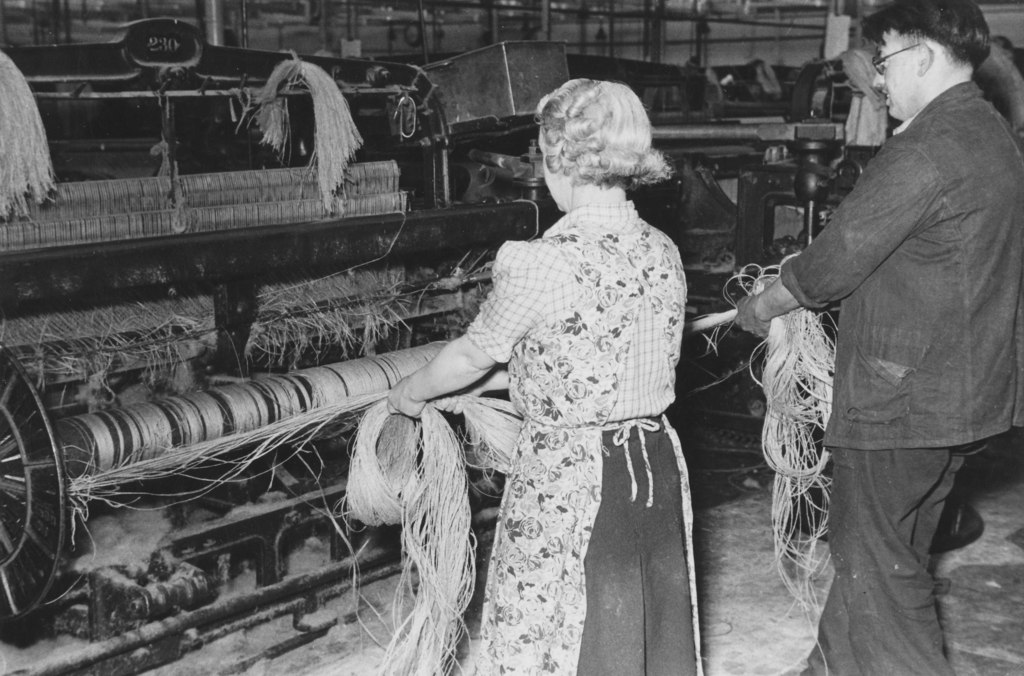 Buist Factory- weaver and tenter setting up a loom DUNIH 2007.59.4