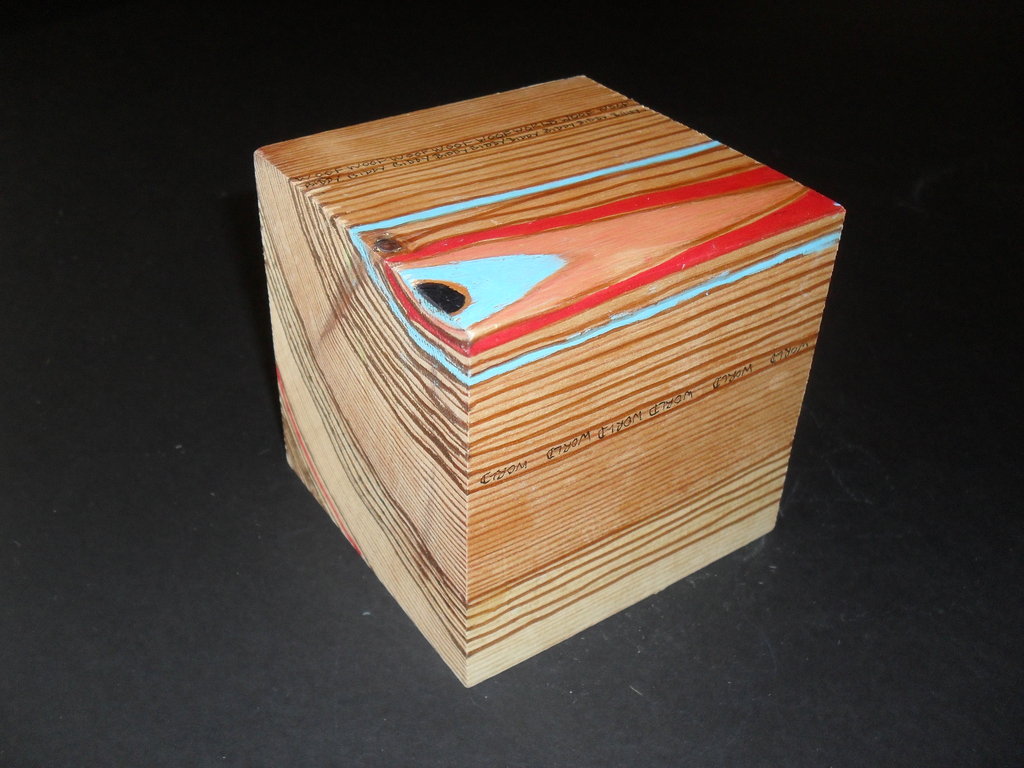 Cube with wood grain emphasised with coloured lines DUNIH 2011.1.54