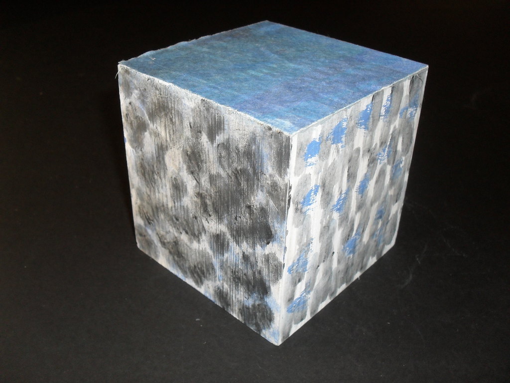 Cube painted with blue, white and grey patches DUNIH 2011.1.57