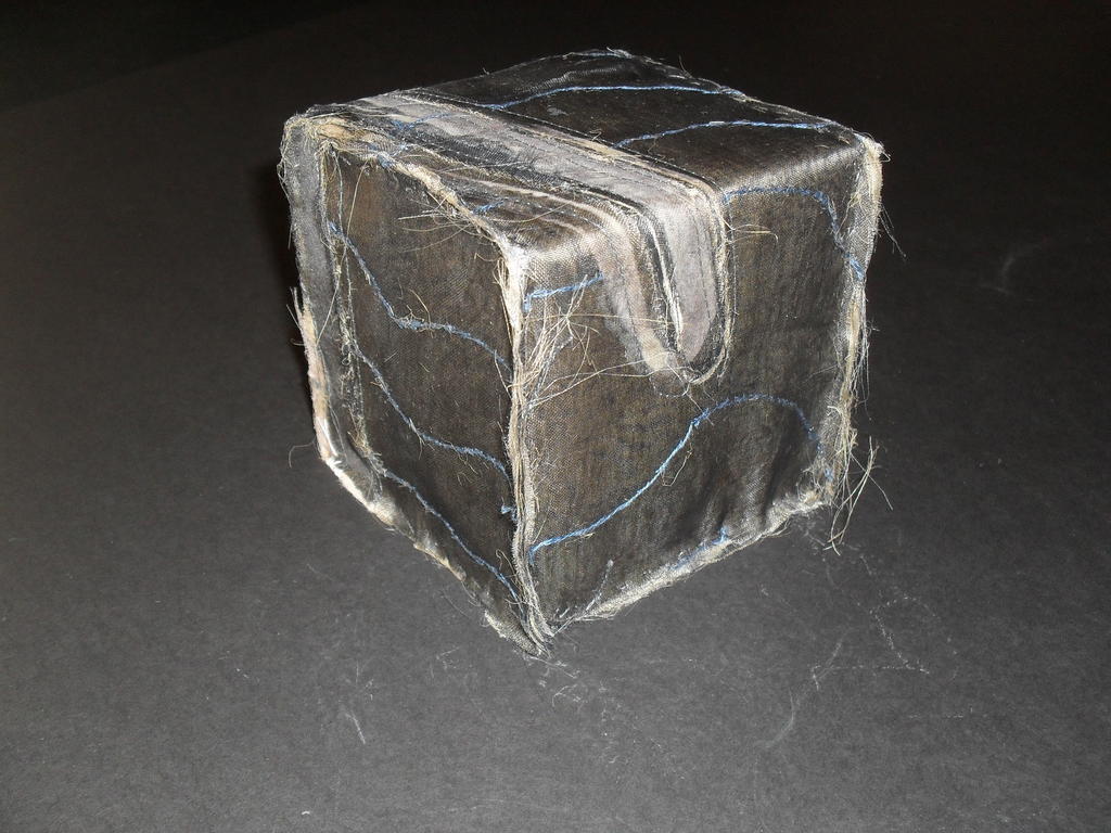 Cube covered in black and grey voile type fabric DUNIH 2011.1.71