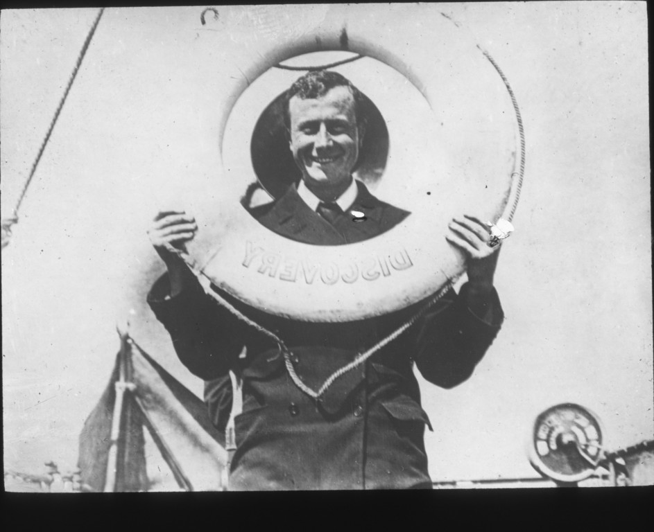Edward Wilson looking through a life ring on Discovery ROY.30.4.22