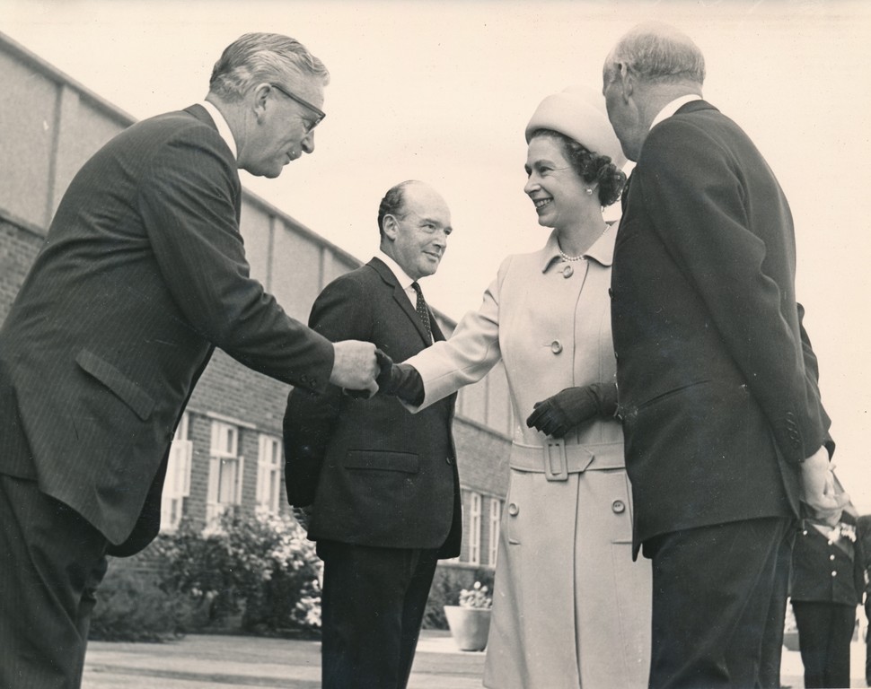 Photograph of the Queen being introduced to Lewis Strachan (Jute Industries Limited Chairman), May 1969 DUNIH 2017.16.2.3