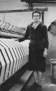 Image of Margaret Millar stood by a winding frame, 3 May 1954 DUNIH 102