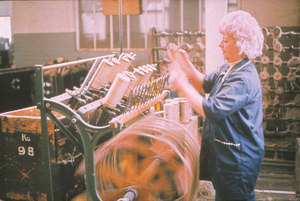 Image of Spinning and weaving - Woman on roll winding frame DUNIH 2006.1.16.1