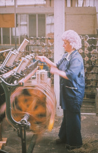 Image of Spinning and weaving - woman on a roll winding frame DUNIH 2006.1.16.4