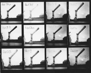 Image of Contact sheet of a frock lift truck lifting a roll of fabric DUNIH 2008.106.19