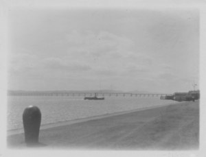 Image of Tay Rail Bridge with boat in foreground DUNIH 2009.26.17