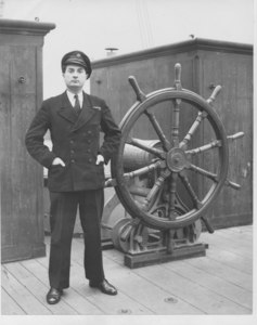 Image of Scout at the ship's wheel DUNIH 2010.11.1