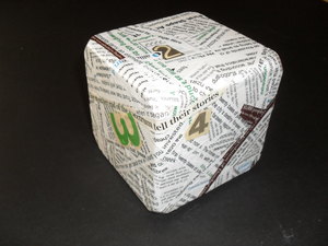 Image of Cube covered in text (1) DUNIH 2010.47.1