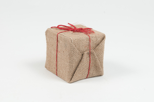 Image of Cube encased in jute with red bow DUNIH 2010.47.12