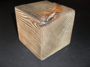 Image of Cube stained brown picking out the texture of the wood DUNIH 2011.1.52