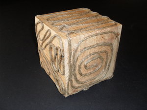 Image of Cube with jute twine snaking over all faces. DUNIH 2011.1.53