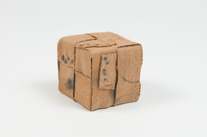 Image of Cube covered in interlaced jute secured by tacks. DUNIH 2011.1.58
