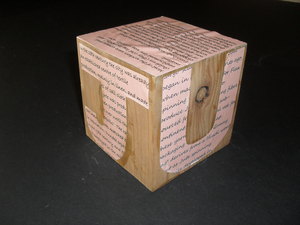 Image of Cube with text re working conditions in the jute industry. DUNIH 2011.1.59
