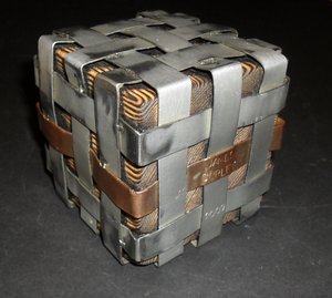 Image of Cube encassed in a silver metal cage DUNIH 2011.1.6