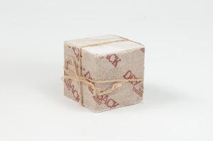 Image of Cube covered in "Dry Sack Sherry" paper DUNIH 2011.1.69