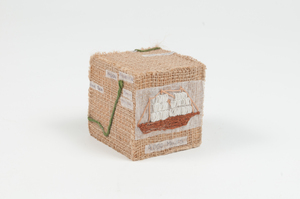 Image of Cube featuring a embroidered sailing vessel DUNIH 2011.1.74