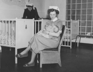 Image of Photograph of Jute Works' Nursery- Nurse feeding baby DUNIH 487.3