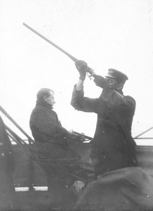 Image of Dr. Edward Wilson & James H Dellbridge shooting from deck of "Discovery" K.19.57