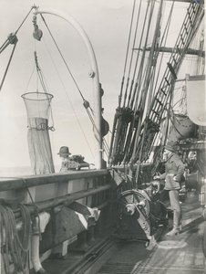 Image of Alister Hardy and F.C Fraser operating plankton net on deck of Discovery DUNIH 2017.2.48